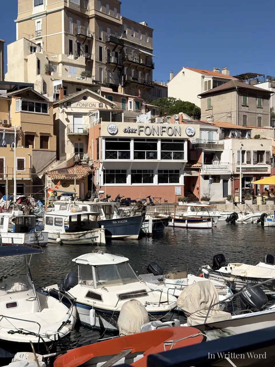 The Chez Fonfon restaurant overlooking small fishing boats moored in the Vallon des Auffes, Marseille.